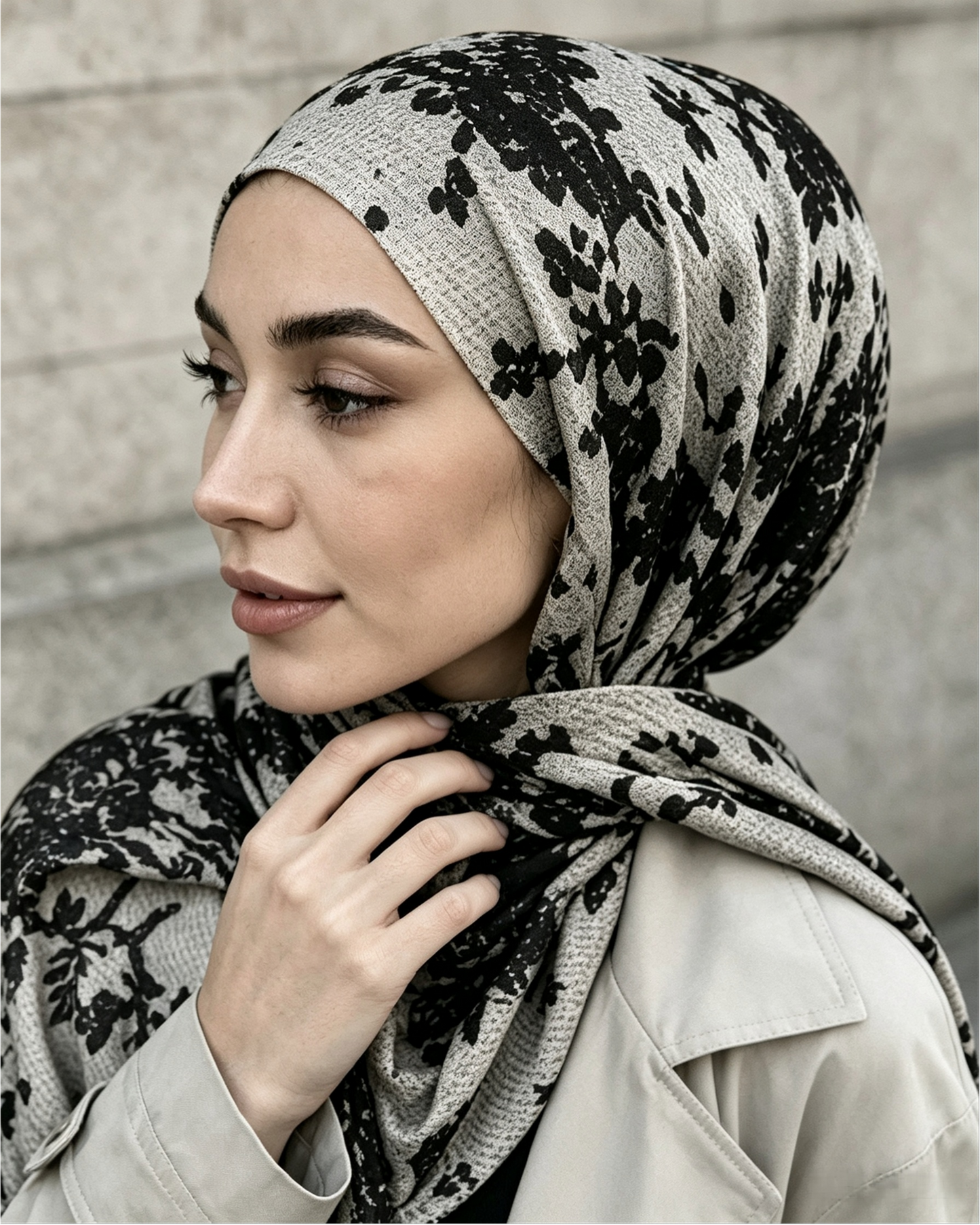 Close-up of black floral hijab wrapped around head and neck