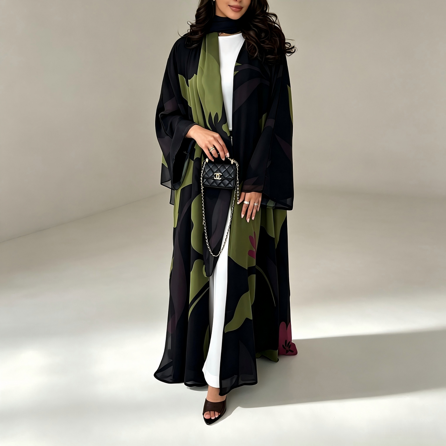 Side view of green ethnic print abaya showing flowing silhouette
